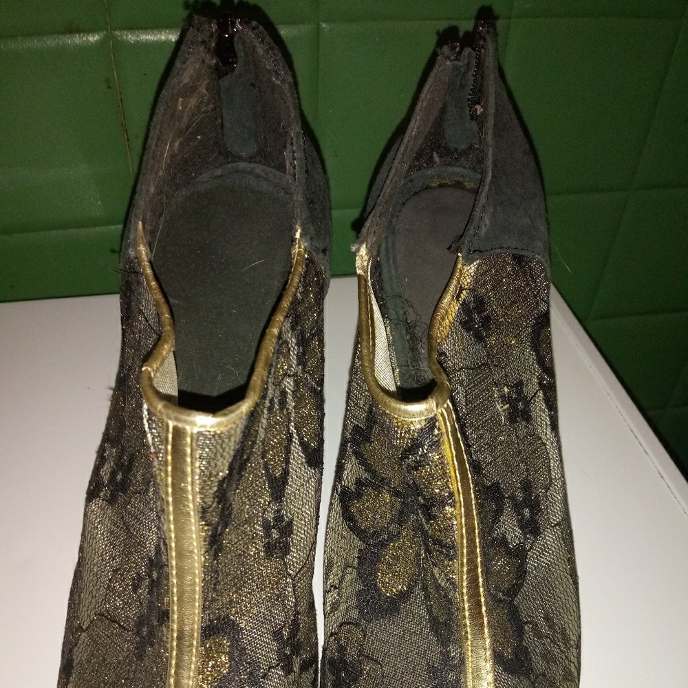 Gold and black shoes